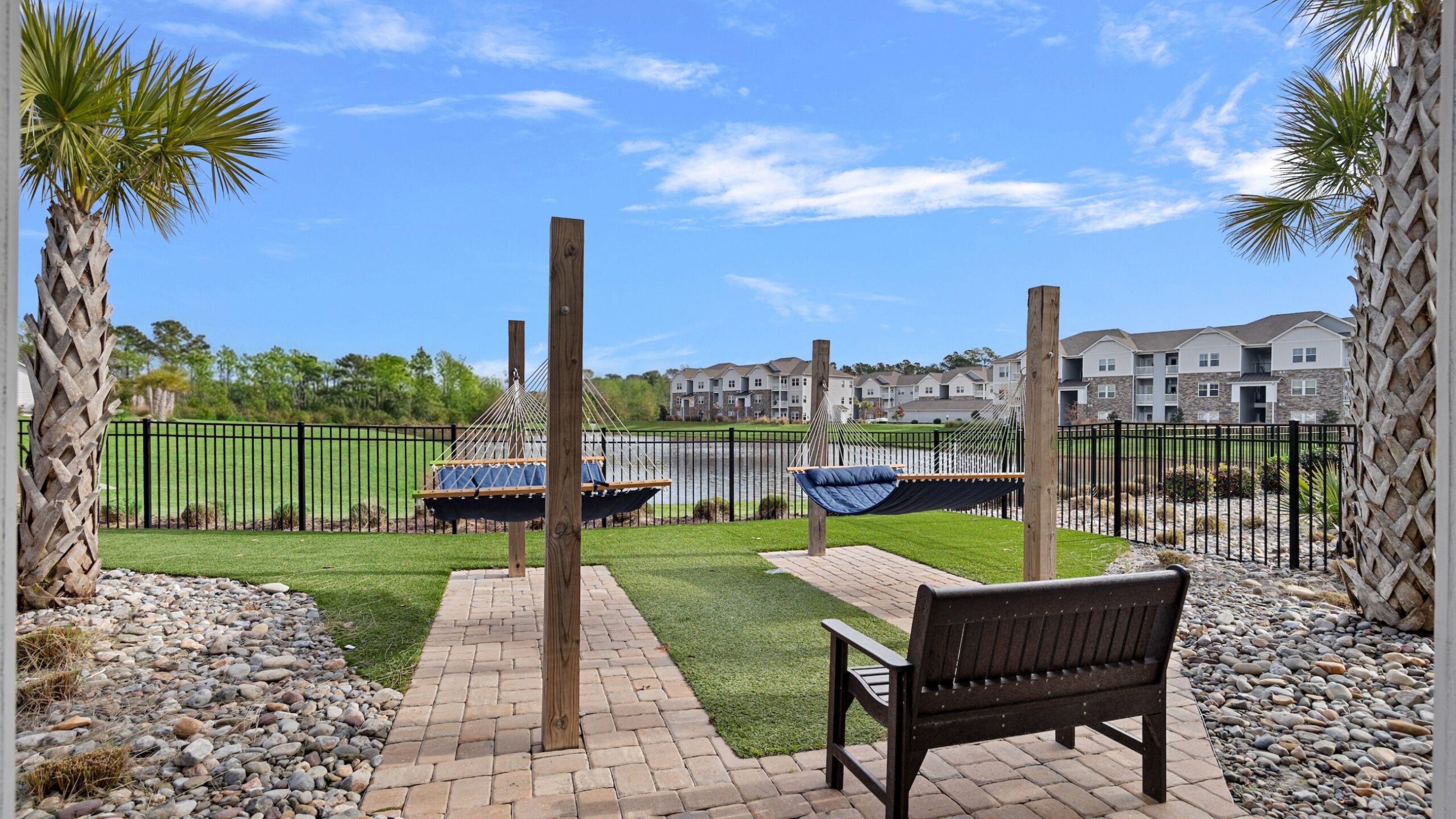 Hawthorne at the Bend outdoor fire pit with Adirondack chairs and grills