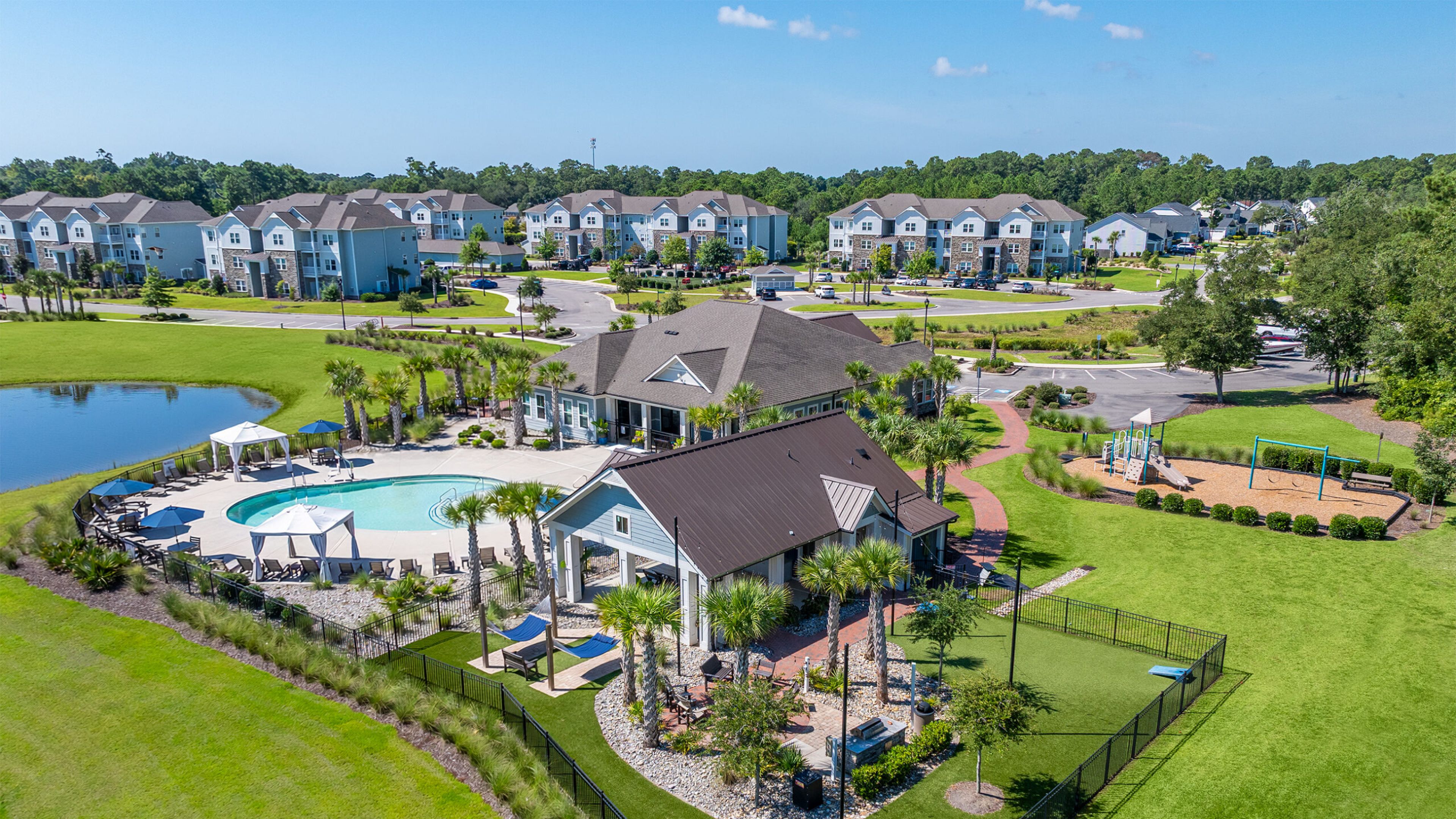 Hawthorne at the Bend uxury outdoor pool with in-pool lounge chairs and surrounding seating